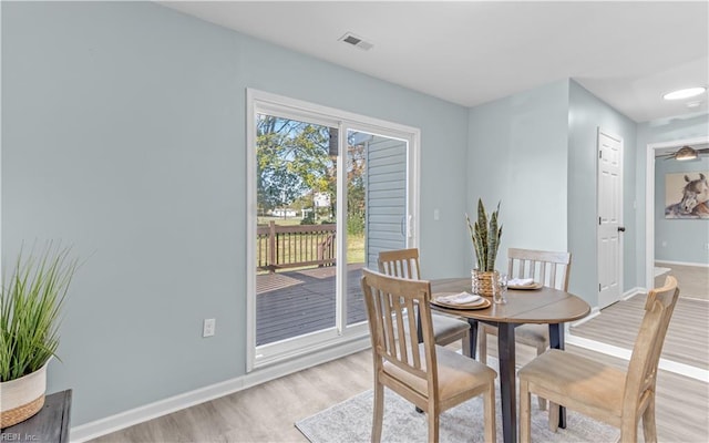 dining space featuring light hardwood / wood-style flooring