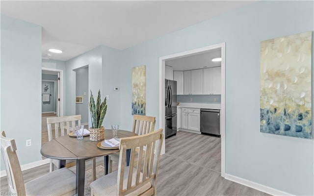 dining room featuring light hardwood / wood-style floors