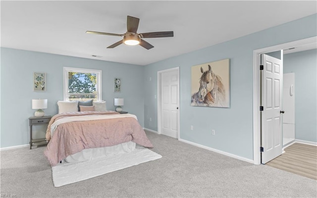 carpeted bedroom with ceiling fan