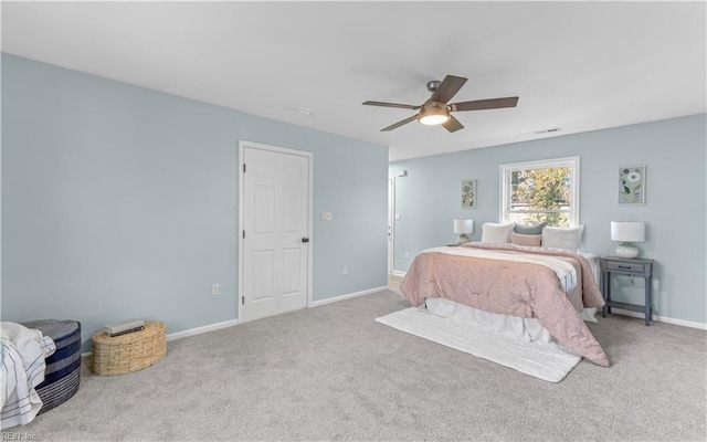 bedroom with ceiling fan and carpet