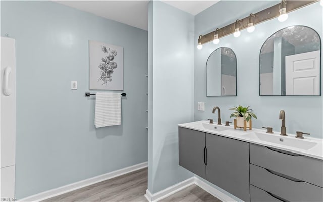 bathroom featuring vanity and wood-type flooring