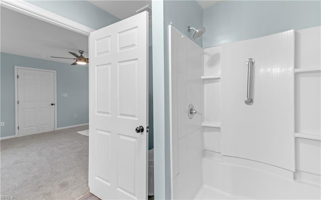 bathroom featuring a shower and ceiling fan