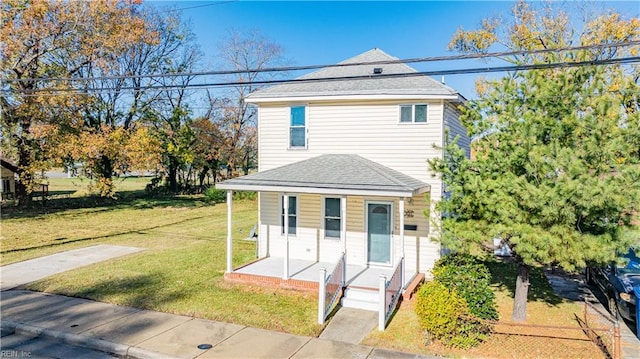 front facade with a front lawn and a porch