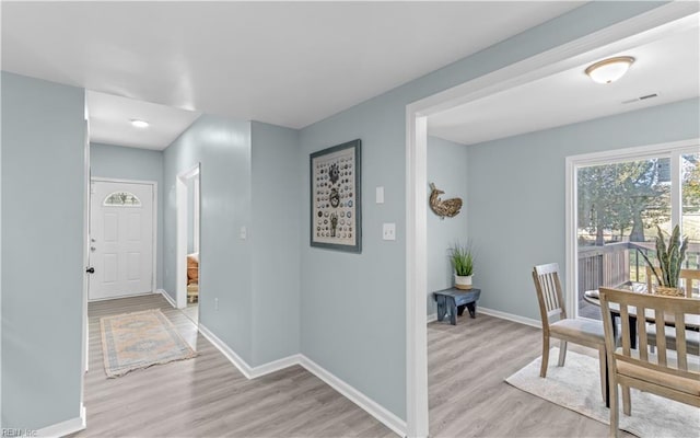 hallway featuring light wood-type flooring