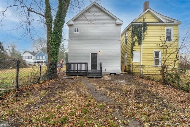 back of house with a wooden deck