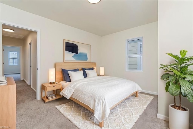 bedroom featuring light colored carpet