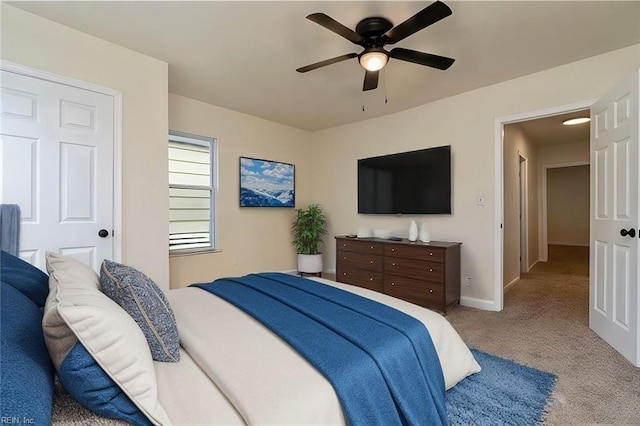 carpeted bedroom featuring ceiling fan