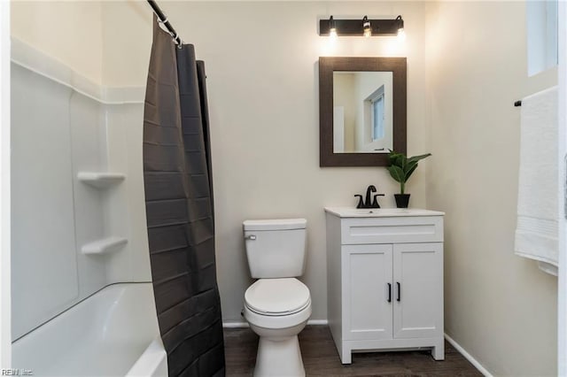 full bathroom with shower / tub combo, vanity, hardwood / wood-style flooring, and toilet