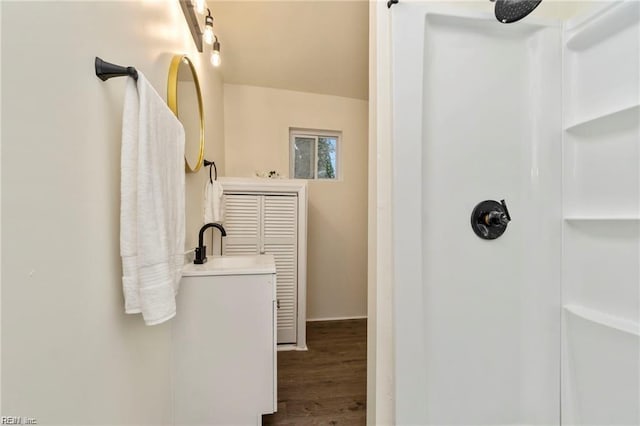 bathroom featuring a shower and hardwood / wood-style floors