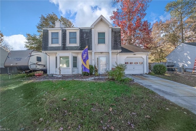 view of front of property featuring a garage and a front lawn