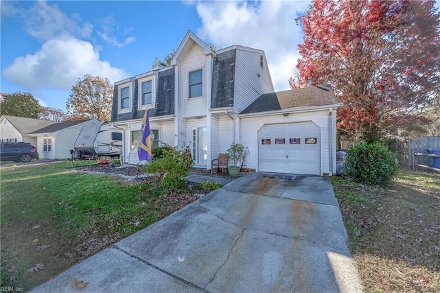 view of front property featuring a garage and a front lawn