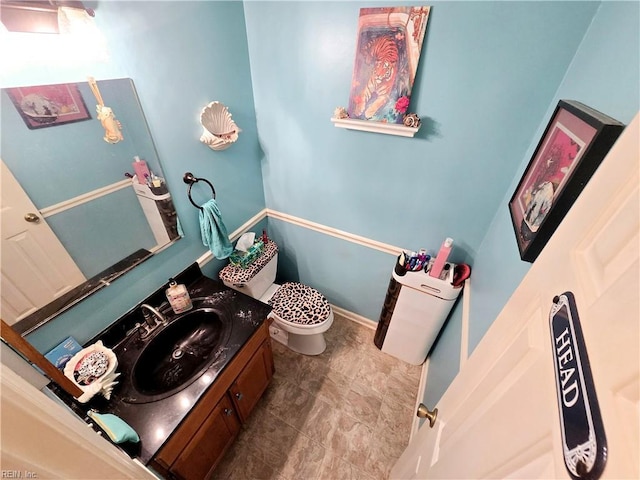 bathroom with vanity and toilet