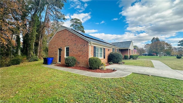 view of property exterior featuring a lawn and solar panels