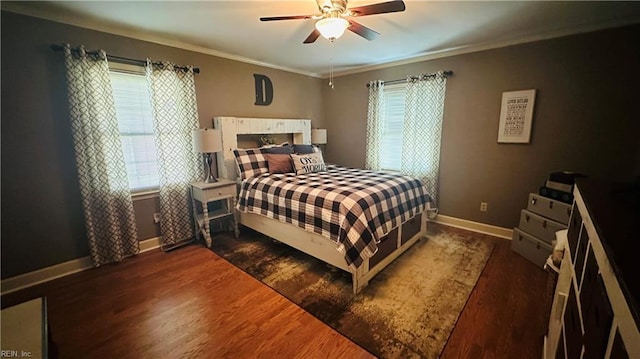 bedroom with multiple windows, dark wood-type flooring, and ceiling fan