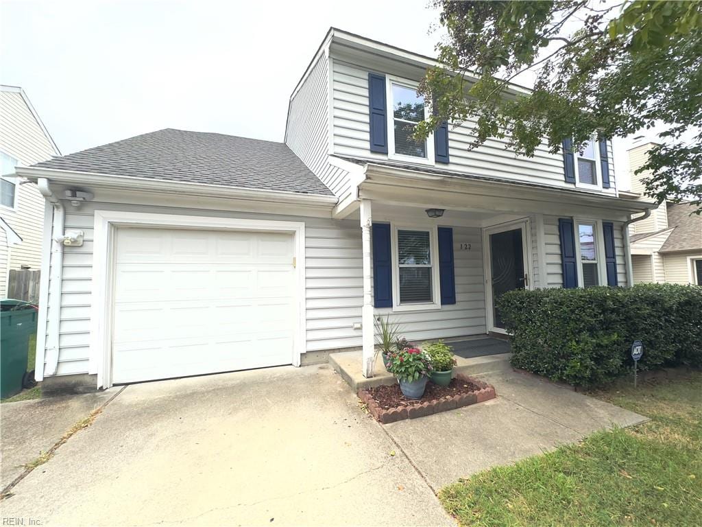 view of front of home featuring covered porch and a garage