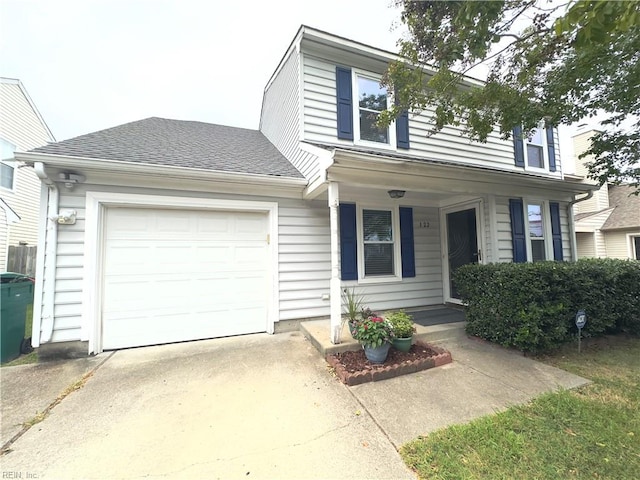 view of front of home featuring covered porch and a garage