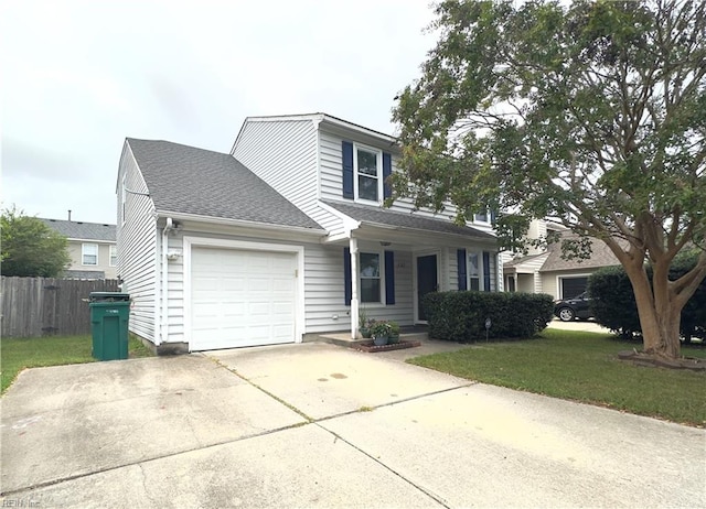 view of front property with a garage and a front yard