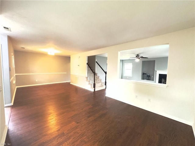 spare room with dark hardwood / wood-style floors and ceiling fan