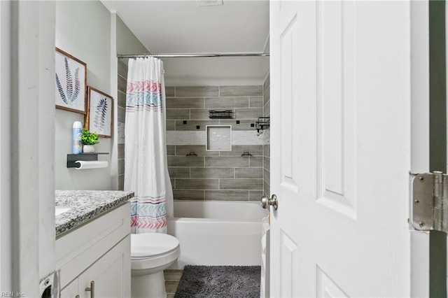 full bathroom with vanity, toilet, and shower / tub combo with curtain