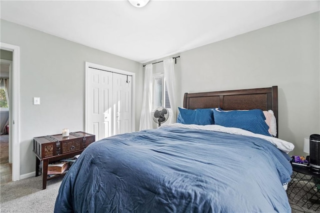 bedroom featuring a closet and carpet floors