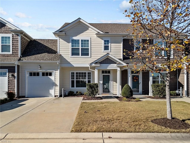 view of front of home featuring a garage and a front yard