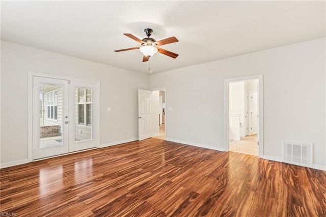 spare room featuring ceiling fan, french doors, and wood-type flooring