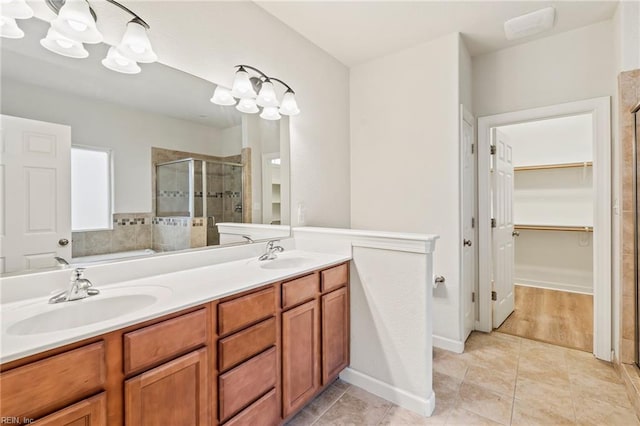 bathroom featuring vanity, tile patterned floors, and an enclosed shower