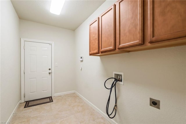 laundry area with hookup for a washing machine, cabinets, and hookup for an electric dryer