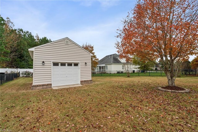 garage featuring a yard