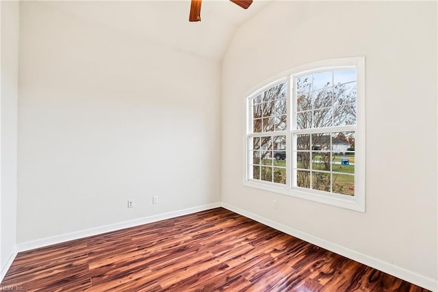 empty room featuring dark hardwood / wood-style floors, ceiling fan, and lofted ceiling