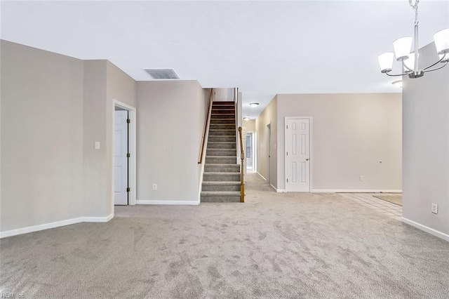 unfurnished living room with light colored carpet and an inviting chandelier