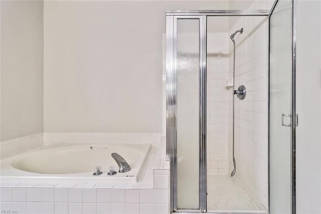 bathroom with separate shower and tub