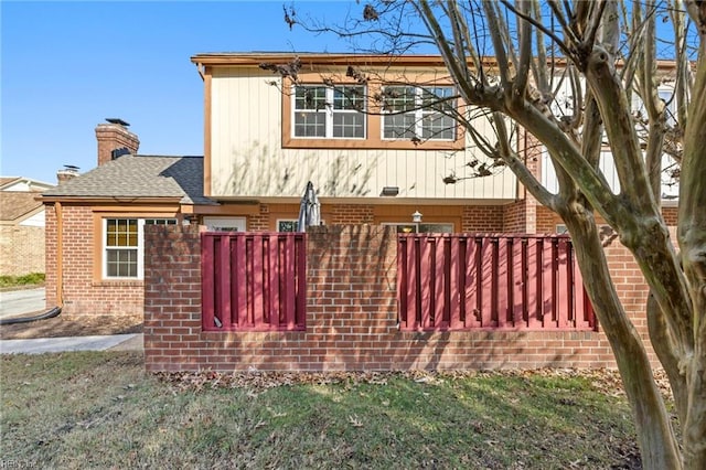 view of property exterior with a yard