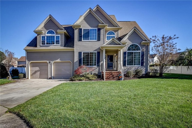 view of front of house with a garage and a front lawn