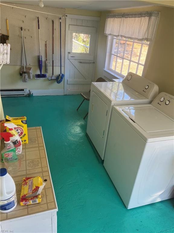 laundry room with separate washer and dryer and baseboard heating