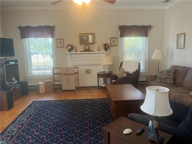 living room with hardwood / wood-style floors, ceiling fan, baseboard heating, and crown molding