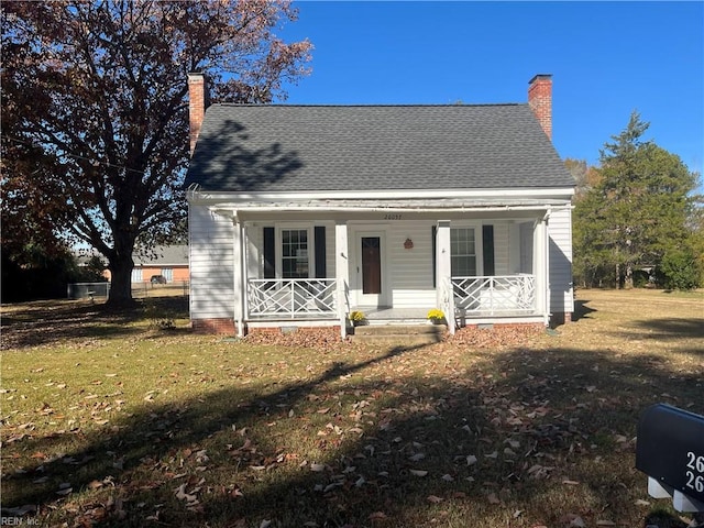 view of front of home with a porch and a front lawn