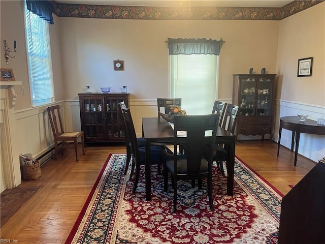 dining room with wood-type flooring