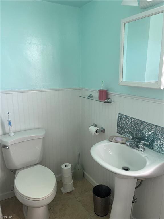 bathroom featuring tile patterned floors and toilet