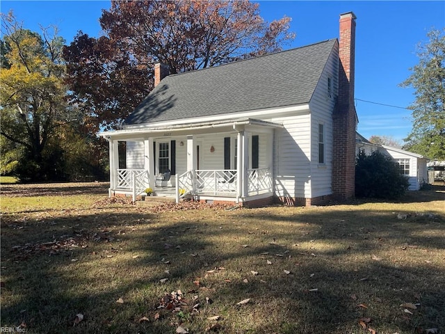 cape cod house with a porch and a front yard