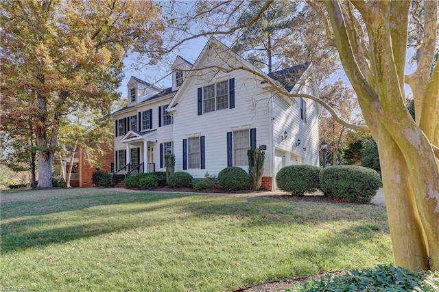 view of front of home featuring a front lawn and a garage