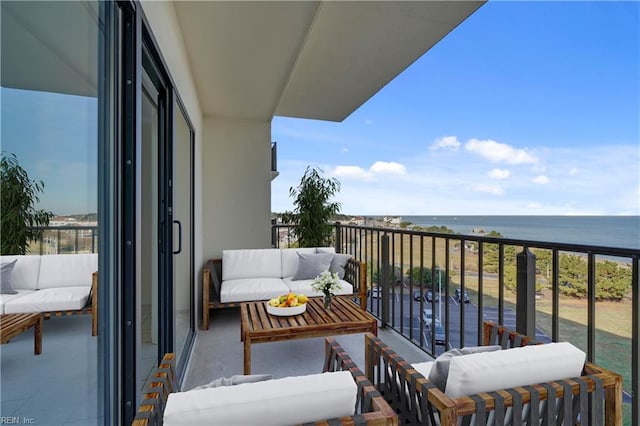 balcony featuring a water view