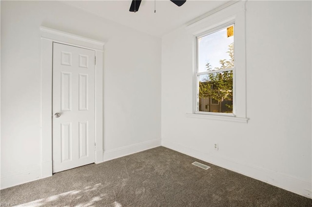 carpeted empty room with ceiling fan