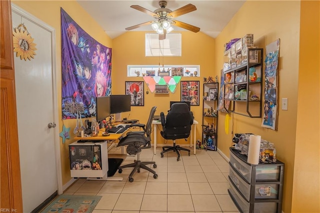 home office featuring light tile patterned floors, vaulted ceiling, and ceiling fan