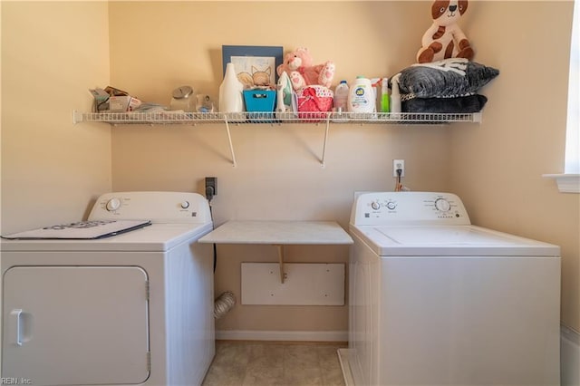 clothes washing area with washer and dryer