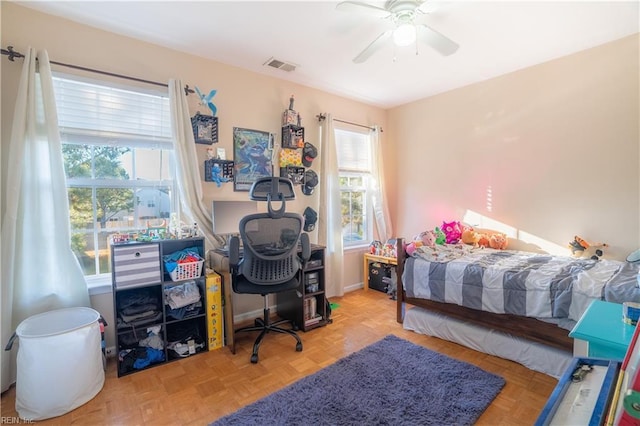 bedroom with light parquet flooring and ceiling fan