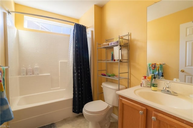 full bathroom with vanity, shower / tub combo, and toilet