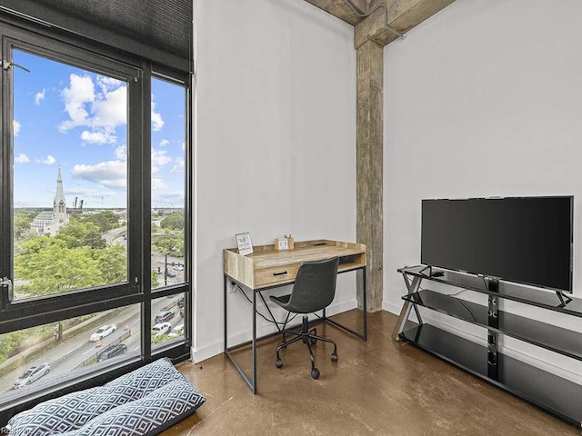 home office with concrete flooring