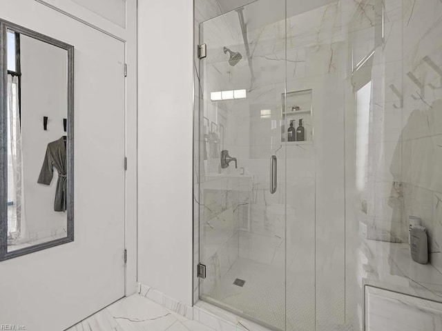 bathroom with an enclosed shower