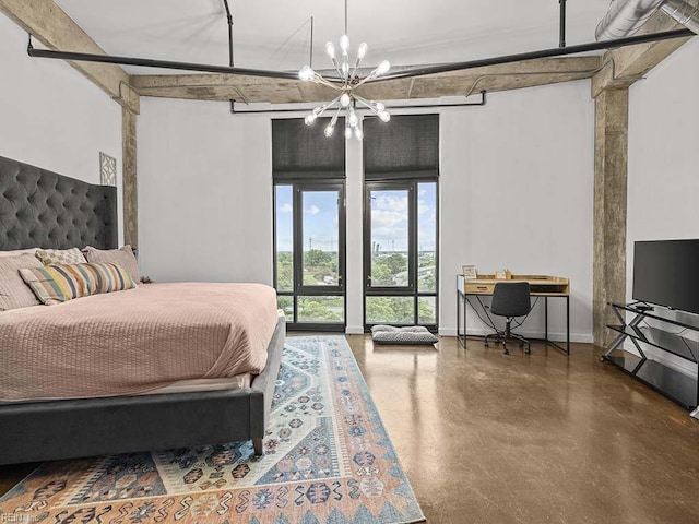 bedroom featuring concrete floors and a notable chandelier